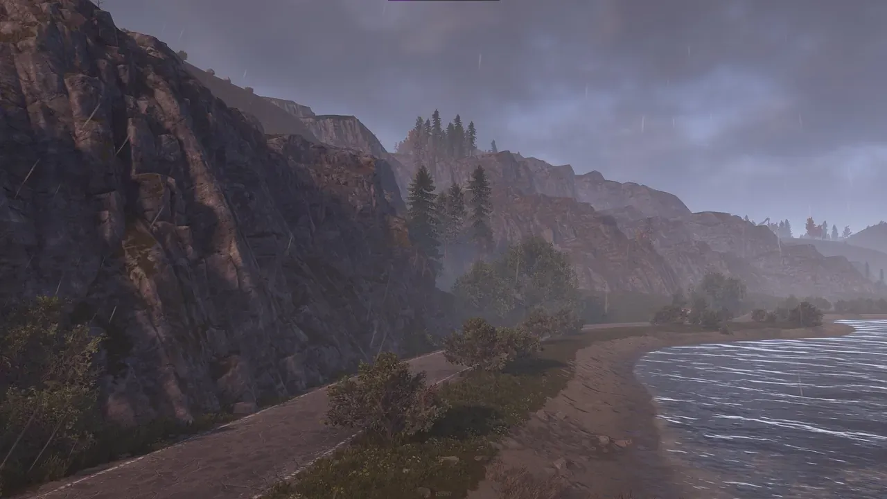 In-game view of a custom Rust map on Crucible terrain: rainy coastal cliffs above a beach