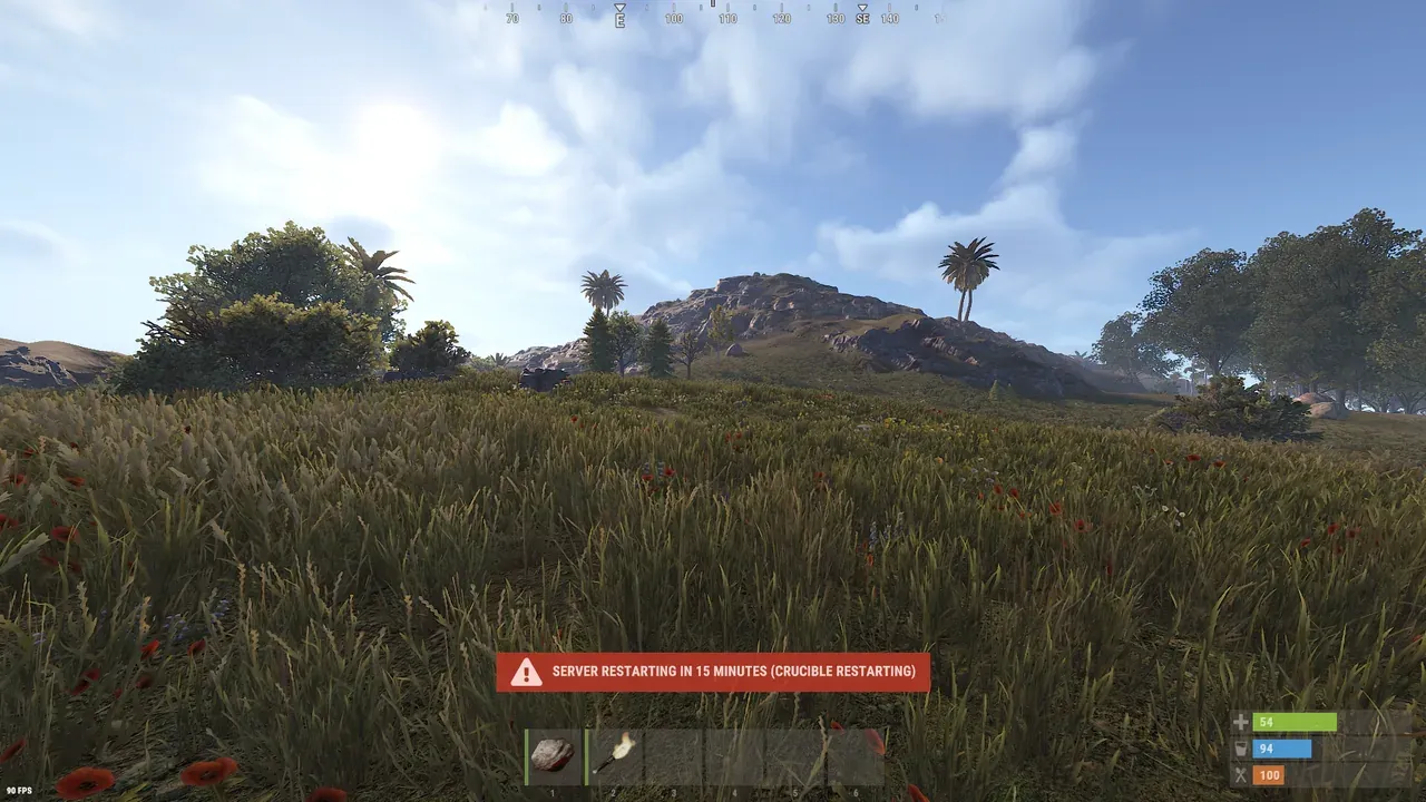 The native Rust in-game restart warning banner reading Server restarting in 15 minutes with the message Crucible Restarting, shown over a first-person view of a Rust world